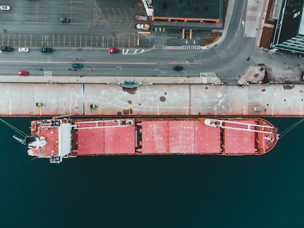 Aerial view of a bulk carrier docked at a pier
